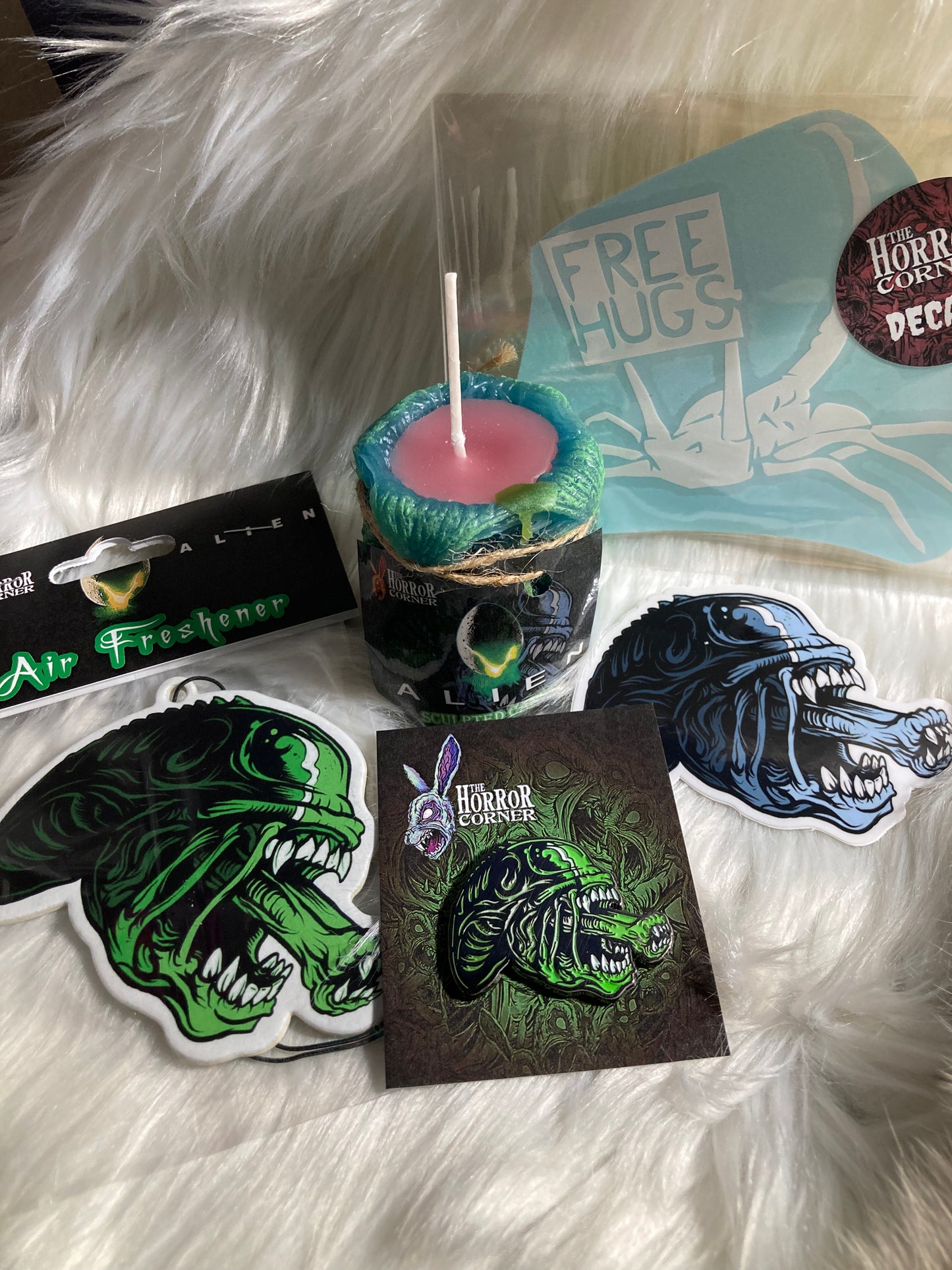 Nostromo themed holiday gift bundle. Bundle contains 1 sculpted alien egg candle, 1 vanilla Xenomorph designed, hangable, air freshener, 1 waterproof vinyl sticker, 1 glow in the dark enamel pin and 1 car window vinyl decal. Celebrate your love for Xenomorph and Facehuggers.